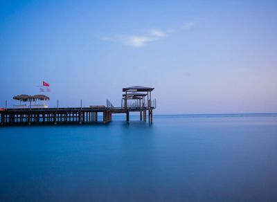 A calm natural landscape with soft blue tones.