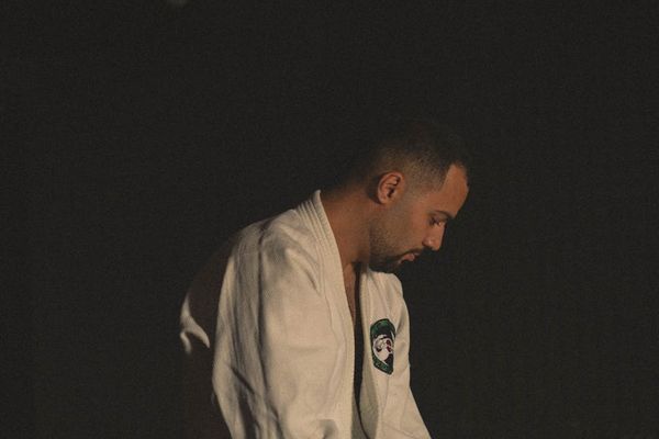 A person peacefully practicing focus exercises in a well-lit room.